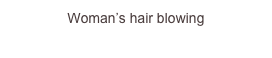 Woman’s hair blowing...